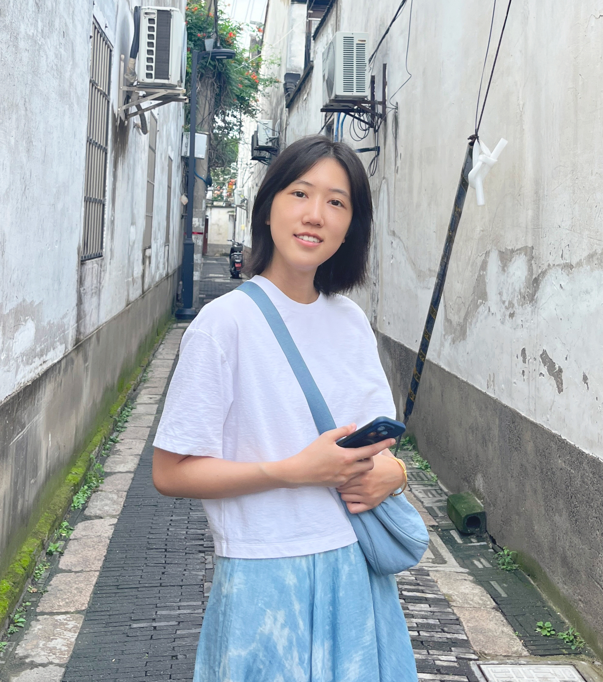 Picture of Lucie smiling at the camera.